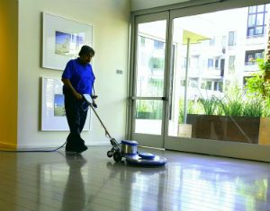 A man buffing a clean floor.