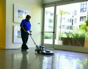 A man buffing a clean floor.